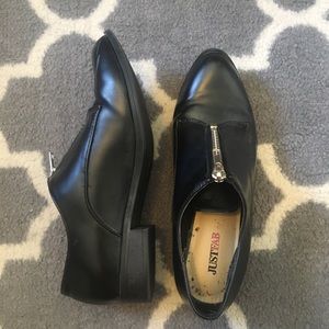 Black leather shoes with zippers